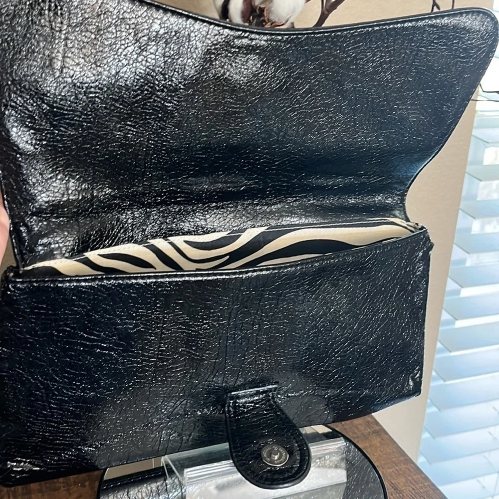 Express Black faux leather envelope clutch, with zebra pattern lining